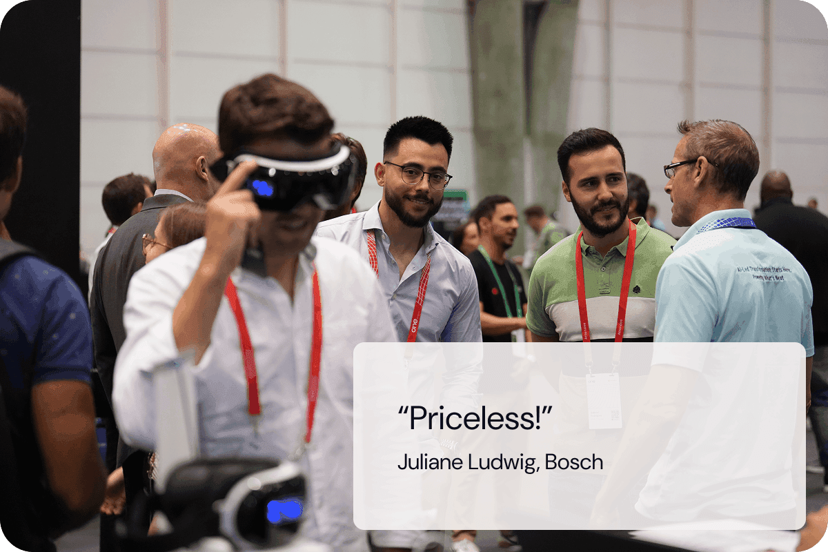 ONE Conference attendees admiring someone using a VR headset