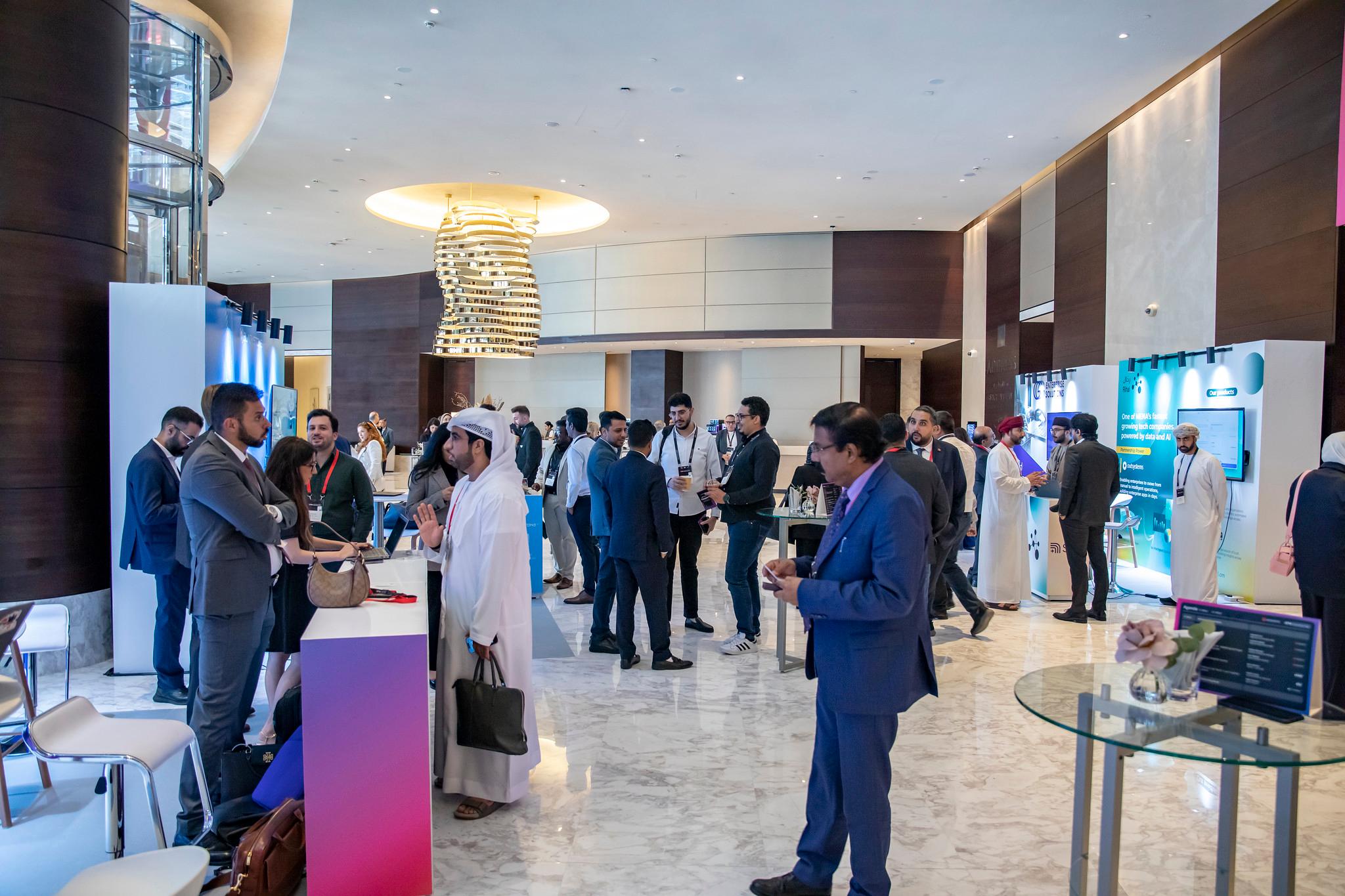 ONE Conference attendees admiring someone using a VR headset