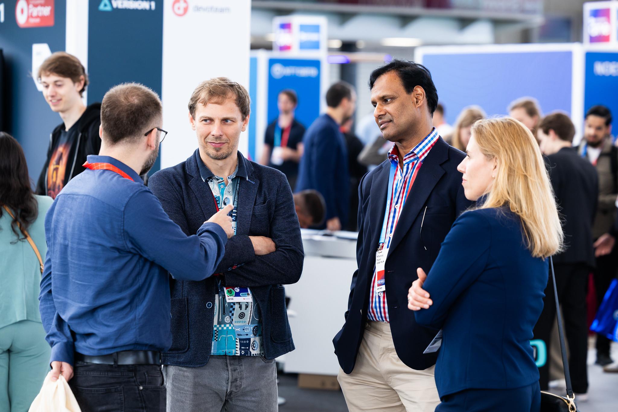 Attendees walking in front of a ONE Conference Ad