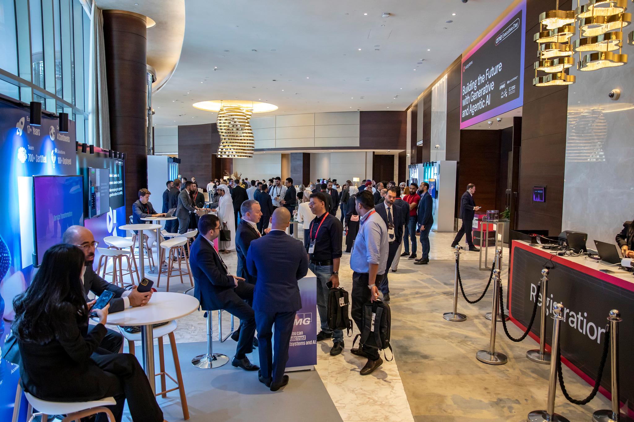 ONE Conference attendees admiring someone using a VR headset